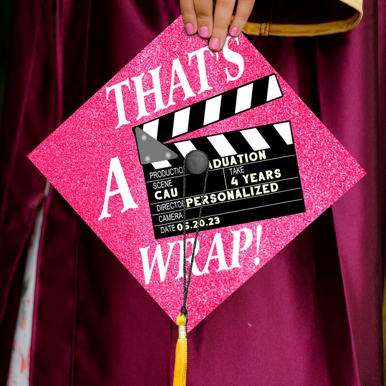 This custom film-themed graduation cap topper features a director's slate design for cinema lovers.
