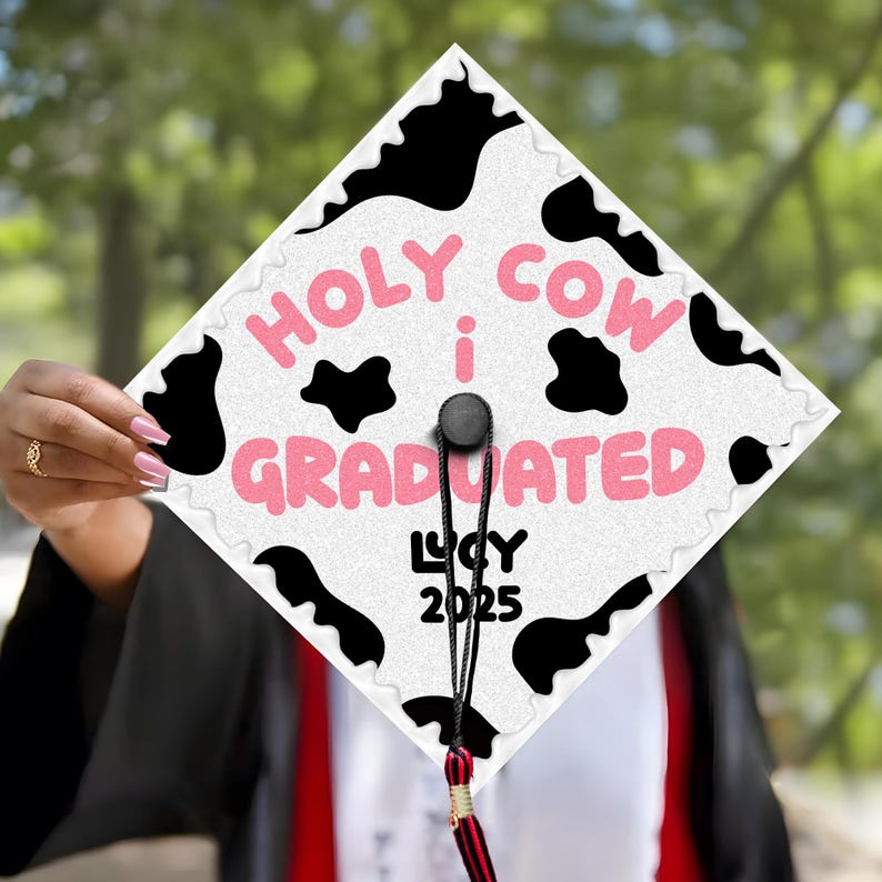 The perfect personalized graduation gift, this cow-themed grad topper is a must-have for the Class of 2026 graduate.
