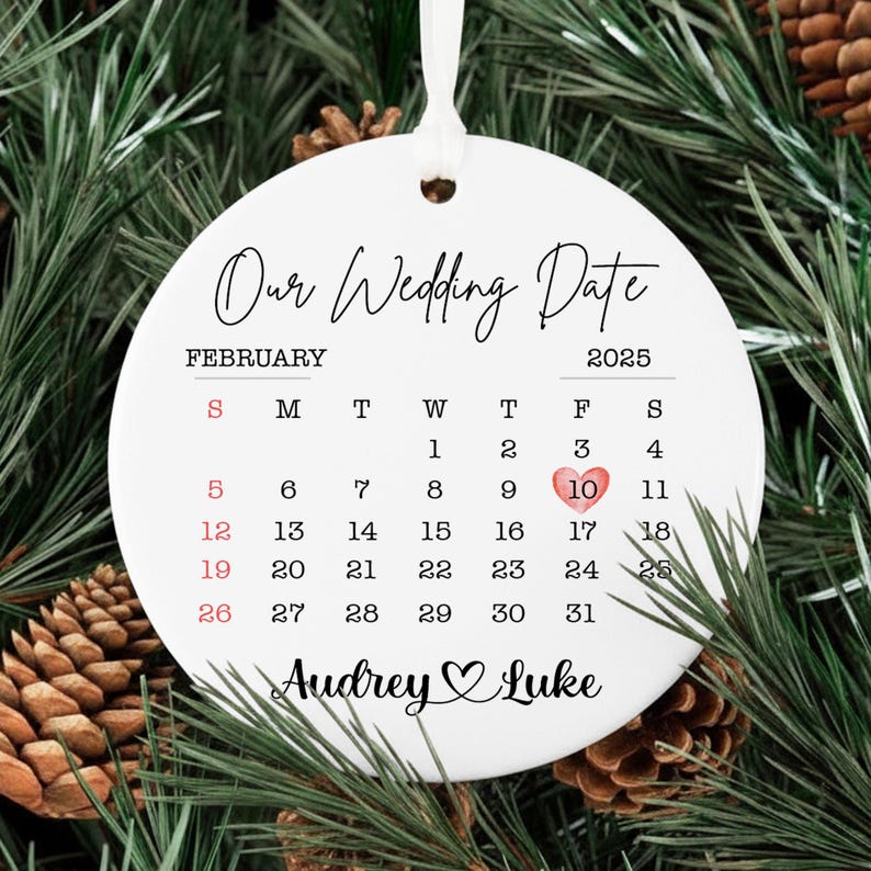 The perfect 1 year engaged anniversary gift, this Personalized Wedding Engaged Calendar Ornament is a beautiful ceramic Christmas tree ornament.