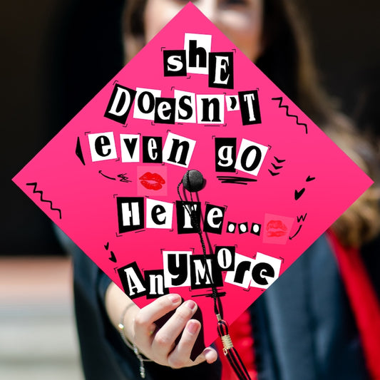 Funny 'She Doesn't Even Go Here Anymore' Grad Cap Topper for Class of 2026, a perfect personalized graduation gift.